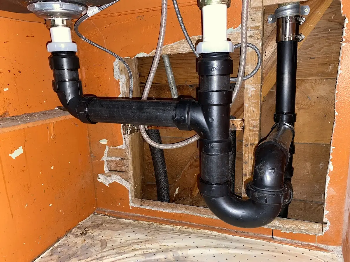 Professional Garbage Disposal Repair equipment and tools on the job in Proctor